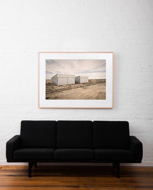 Australia Landscape photo framed in raw timber on white wall above sofa