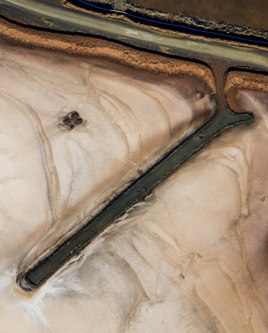 A horizontal abstract , aerial photo of Australian Landscape in green and brown .