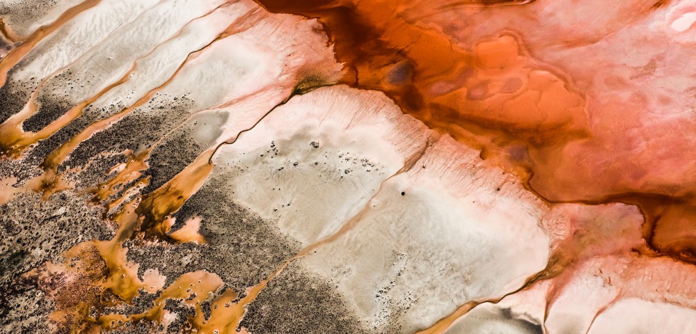 A Abstract, Aerial photo of Australia Landscape in Pink, Red, Brown and Orange .