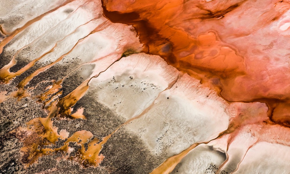 A Abstract, Aerial photo of Australia Landscape in Pink, Red, Brown and Orange .