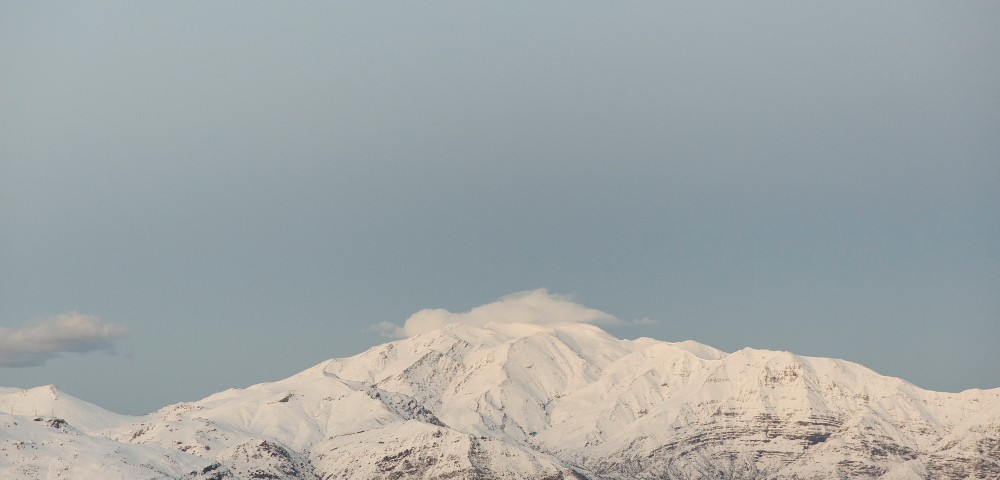 A photographic print taken in the Andes, Chile after a snowstorm. Colours in blue white and grey