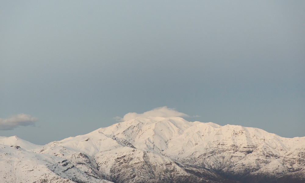 A photographic print taken in the Andes, Chile after a snowstorm. Colours in blue white and grey