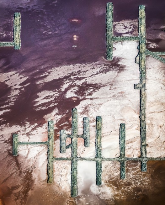 A Vertical Abstract Aerial photo of Australian Landscape in Pink, Purple and Red