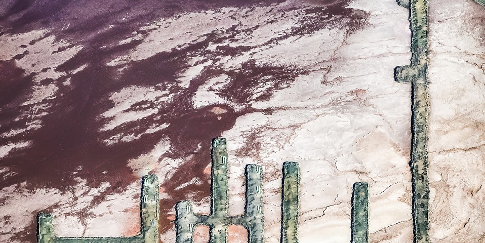 A Vertical Abstract Aerial photo of Australian Landscape in Pink, Purple and Red