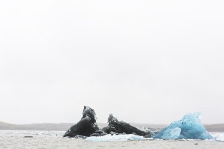 Large Blue and white Icelandic landscape of water, sky, glacier and snow.