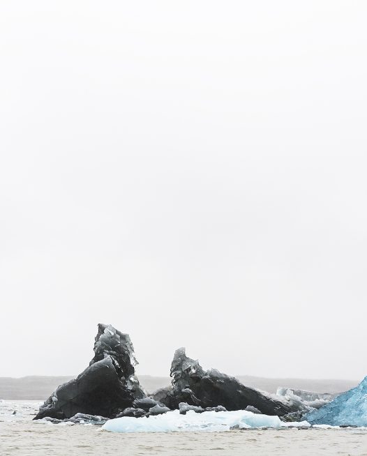 Large Blue and white Icelandic landscape of water, sky, glacier and snow.