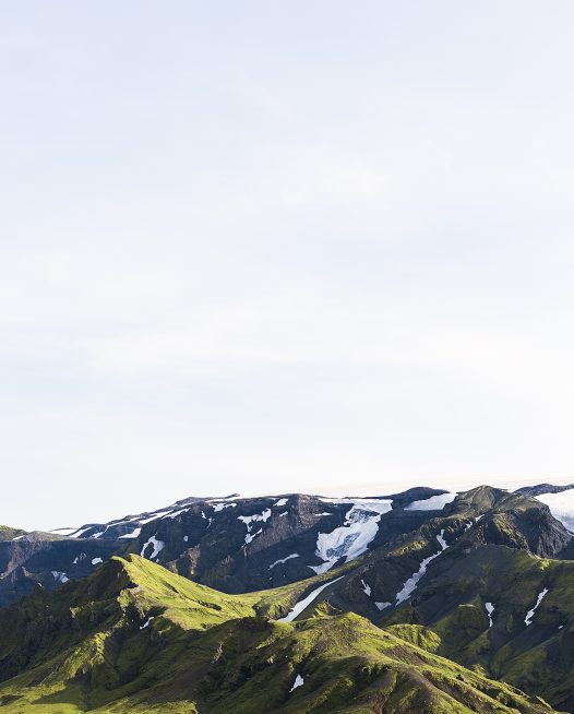 Icelandic Landscape photo in green and blue of glaciers, mountain, snow and blue sky