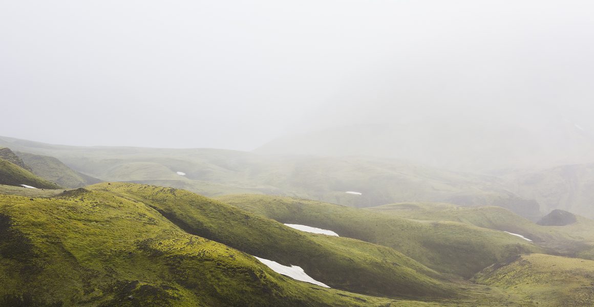 Misty Green Iclandic landscape of mountains and snow