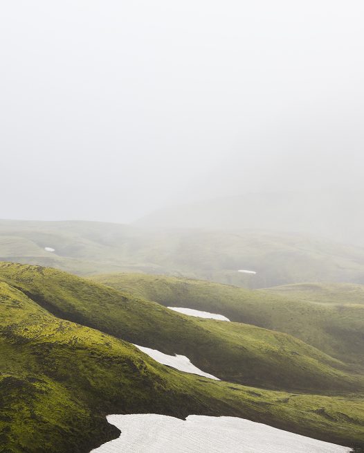 Misty Green Iclandic landscape of mountains and snow