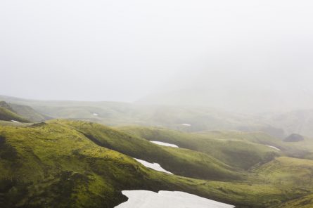 Misty Green Iclandic landscape of mountains and snow