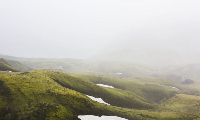 Misty Green Iclandic landscape of mountains and snow