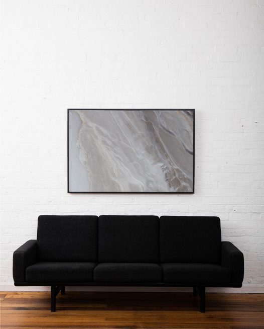 An aerial photo of inland Australian landscape in grey, brown colour framed in black timber above sofatimber.