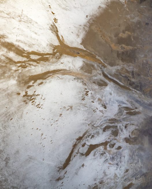 An aerial photo of inland Australian landscape in brown, grey and purple colour