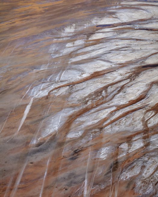 An aerial photo of inland Australian landscape in grey, brown and orange colour